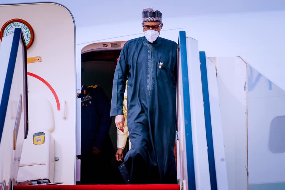 President Buhari returns from France