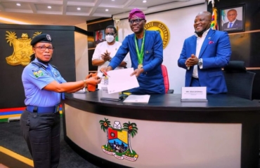 Governor Sanwo-Olu presents documents to a 3-bedroom flat to Chioma Ajunwa
